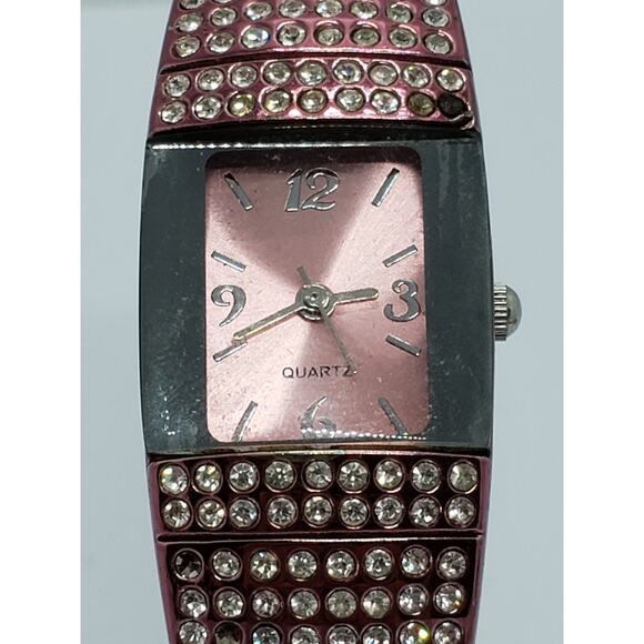 Women\'s watch. Rose pink bangle band with jewels on face. F334565-1/LS